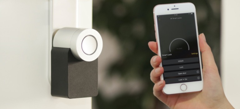 A person using a smart lock feature in their home